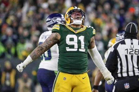 Green Bay Packers linebacker Preston Smith reacts after sacking Seattle Seahawks quarterback Russell Wilson during the second half of the Sunday's NFC Divisional Playoff games at Lambeau Field.