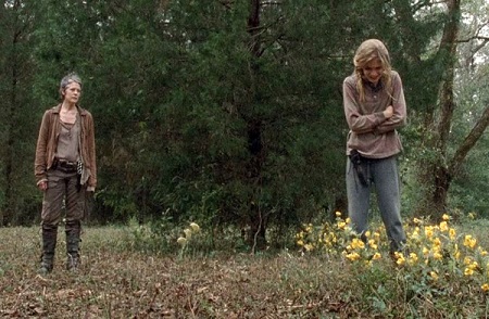 Before 'Carol' shoots 'Lizzie' in the back of her head when she is looking at the yellow flower patch.