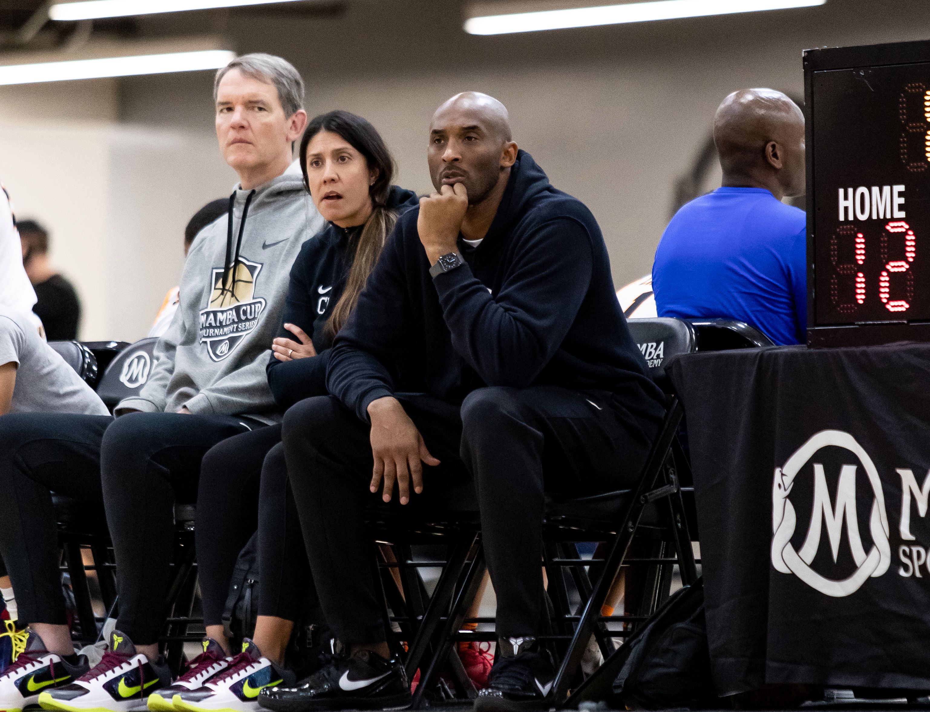 Christina Mauser with Kobe Bryant during a game.