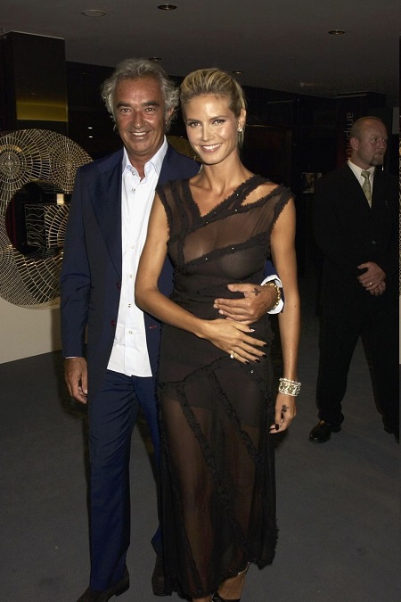 Flavio Briatore with his arm around Heidi Klum.