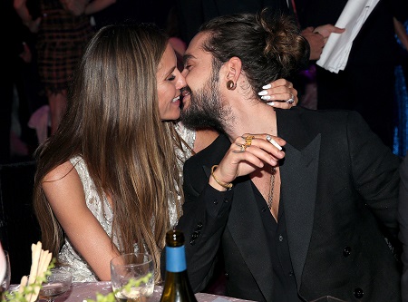 Heidi Klum and husband Tom Kaulitz almost kissing.