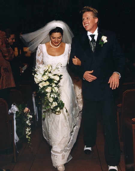 Gary Busey and his ex-wife, Tiani Warden, in their wedding attires walking down the aisle.