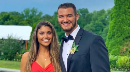 Mitch Trubisky in a black tux poses a picture with his girlfriend Hillary Gallagher.
