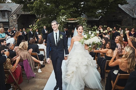 Alaia Baldwin and her husband Andrew Aronow in their wedding dresses right after being pronounced husband-wife.