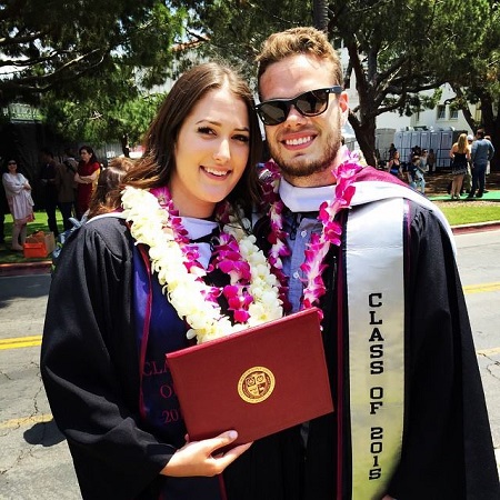 Emily Trebek and her boyfriend in their graduation gowns from Loyola Marymount University.