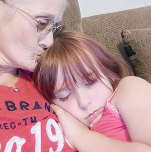 Faye Swetlik napping in her grandmother's arms..