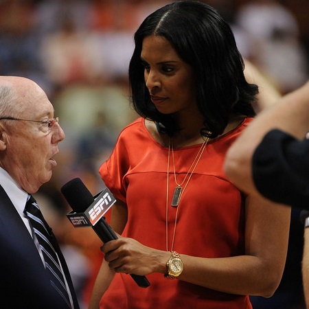 ESPN reporter and former Lady Deac LaChina Robinson interviewing someone.