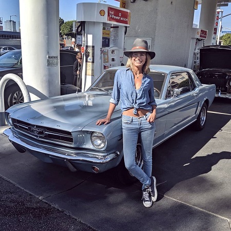 Heather Storm in front of her Mustang.