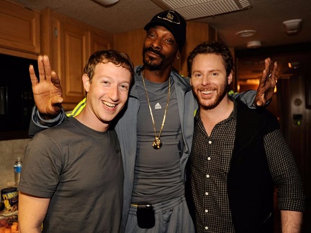 Sean Parker (right) with Mark Zuckerberg (left) and a rapper (center).