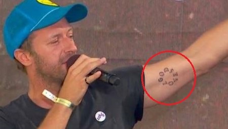 Chris Martin Tattoo: GODS LOVE.