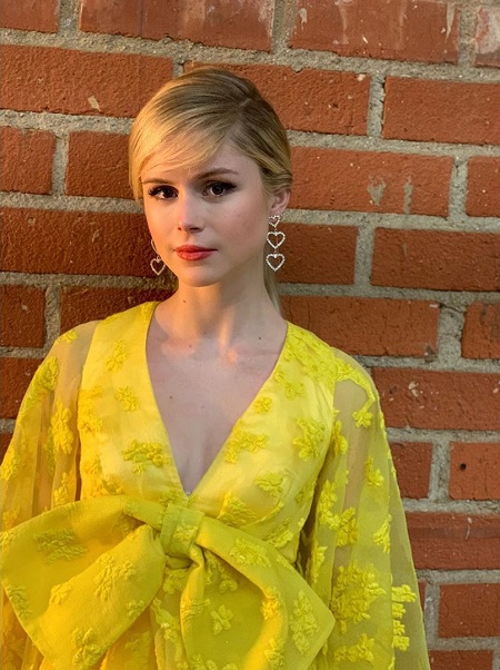 Erin Moriarty in a yellow-colored traditional Japanese dress.