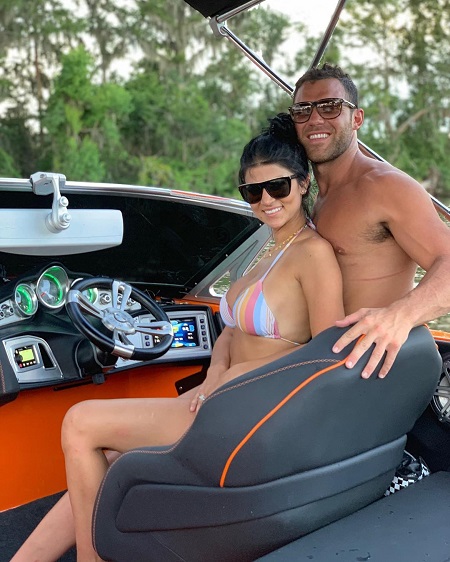 Alex Kompo and girlfriend Alyssa Salerno in a speedboat.