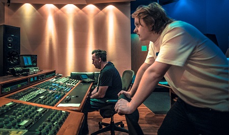 Lewis Capaldi in the recording studio with his recording manager.
