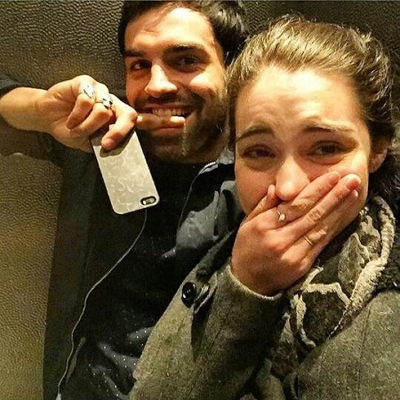Adelaide Kane with her 'Reign' co-star Sean Teale in an elevator.