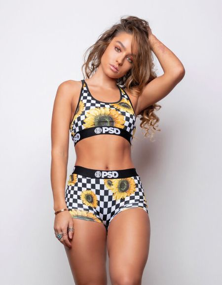 Sommer Ray posing on her clothing line.