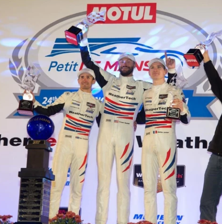 Cooper Macneil celebrates the win Motul Petit Le Mans race at Michelin Raceway.