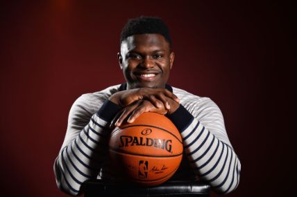 Zion Williamson posing with a ball.