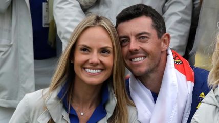 Rory McIlroy and his wife Erica Stoll pictured grinning in crowd.