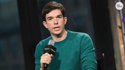 John Mulaney performing for the audience.