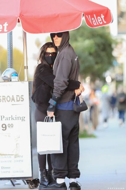 Kourtney Kardashian and Travis Barker giving PDA.