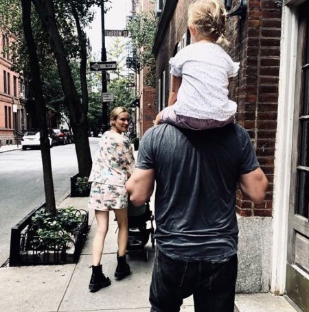 Norman Reedus and Diane Kruger together with their child