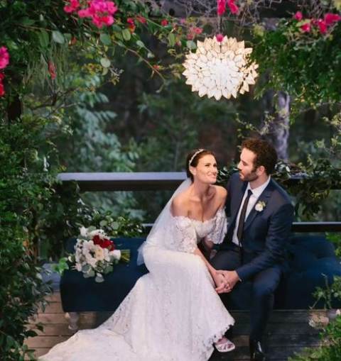 Idina Menzel and her husband, Aaron Lohr, celebrating their wedding.