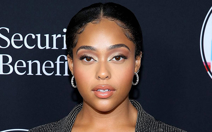 Jordyn Woods Went Braless In Plunging Khaki Dress