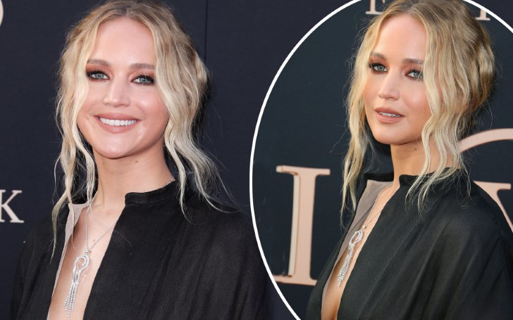 Jennifer Lawrence Displays Cleavage In A Deeply Plunging Black Gown